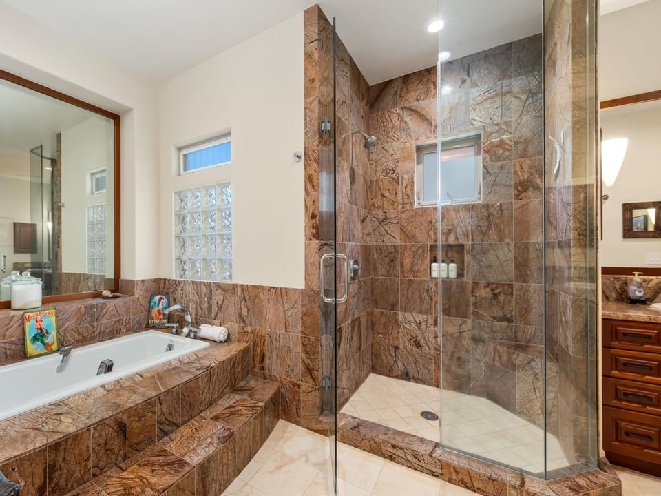 Primary ensuite with soaking tub and standing shower