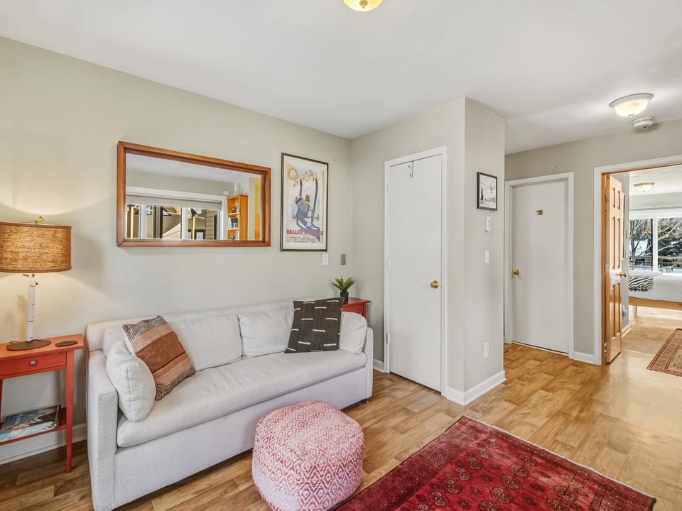Cozy living area as you enter the condo perfect for family games and chilling after a fun day.