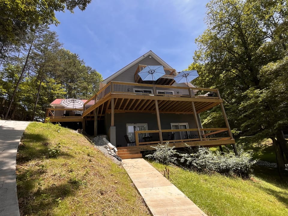 Two levels of outdoor patio space with a balcony for one of the top-level bedrooms.