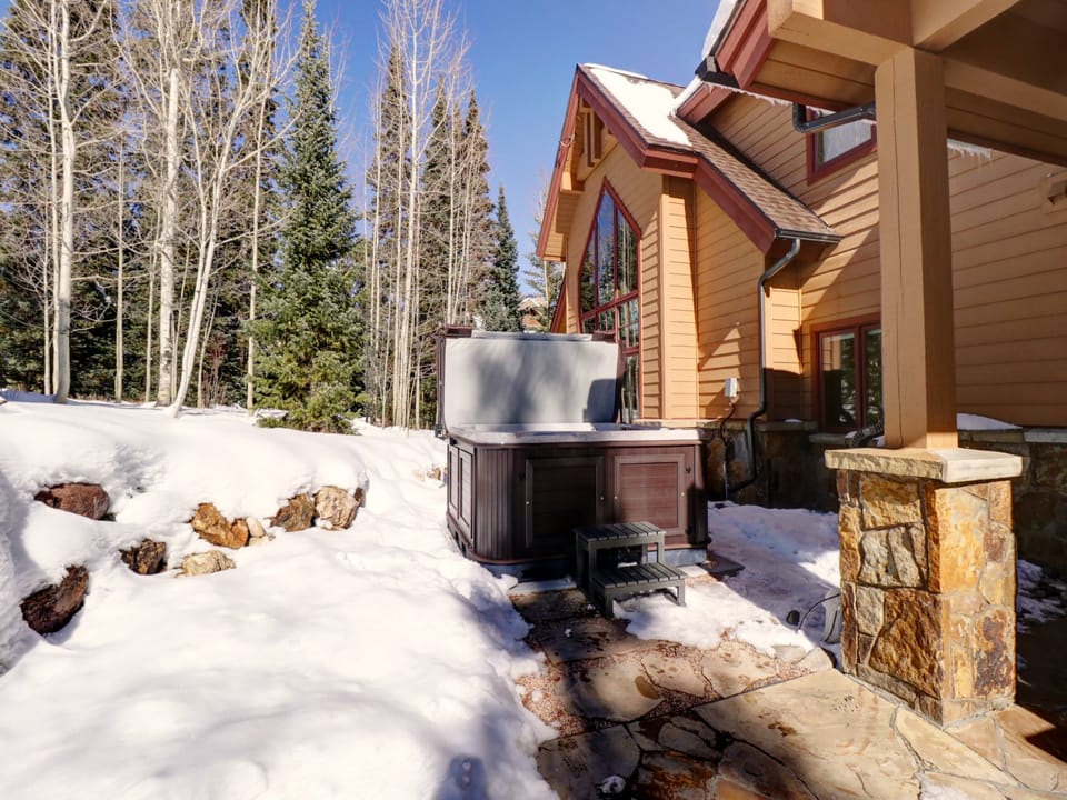 The home features a large private hot tub in the backyard.