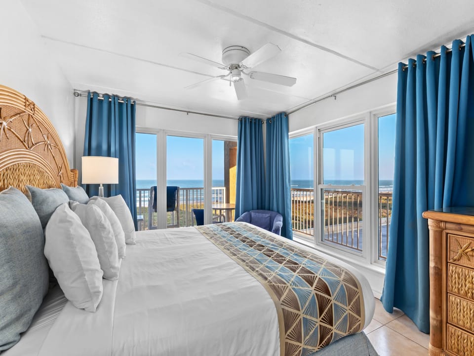 Master bedroom with a gorgeous panoramic sunrise and beach view!