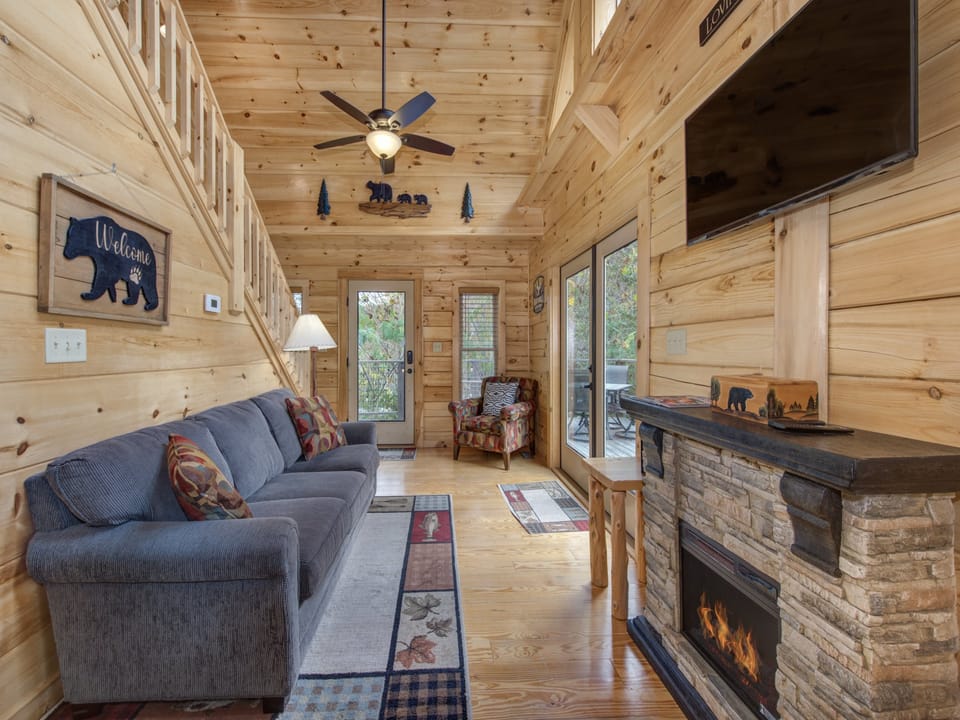 Living room with fireplace and vaulted ceilings