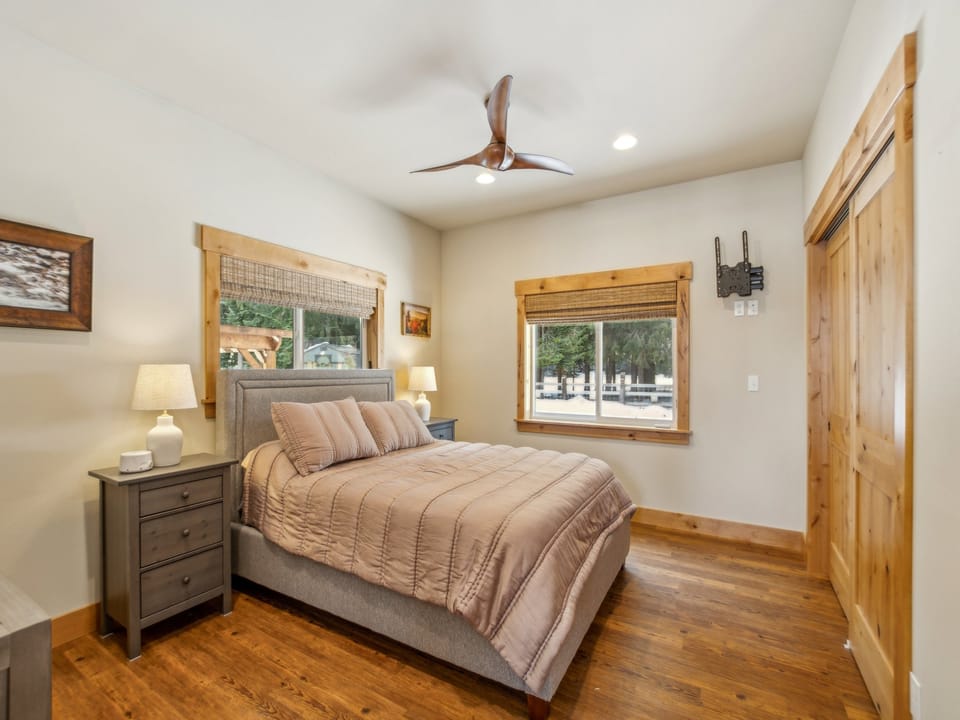 Primary bedroom with queen bed and attached private bathroom