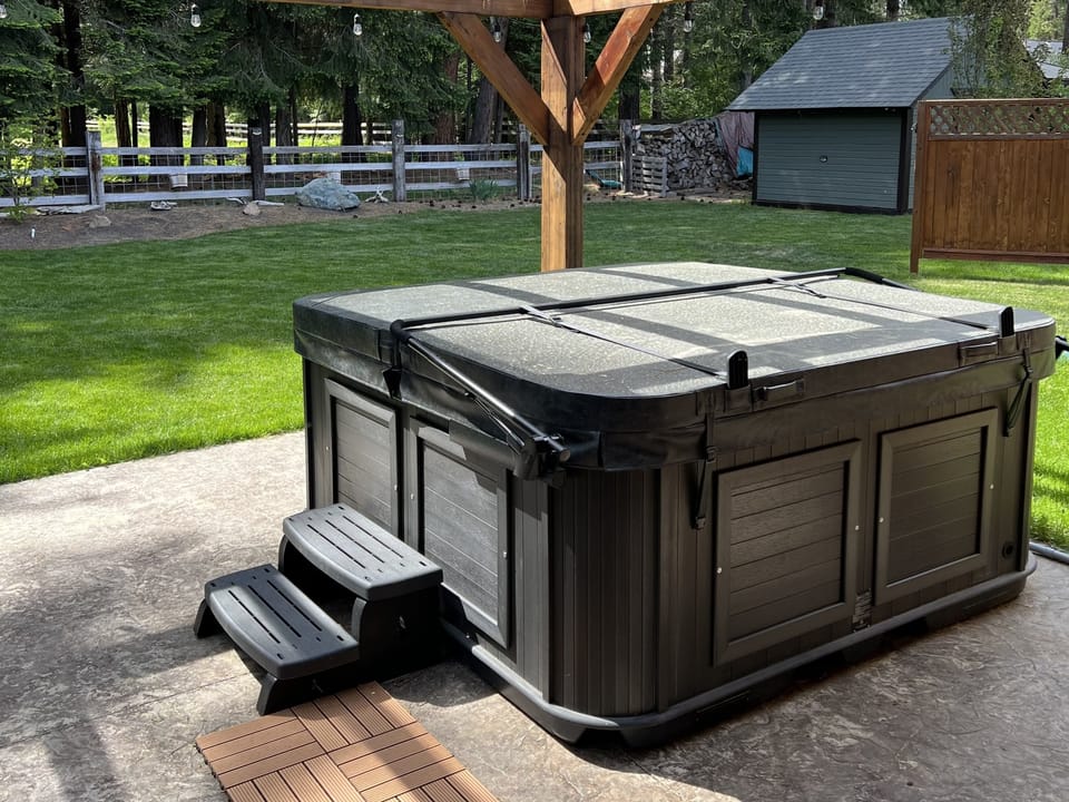 7-person saltwater hot tub on spacious back patio
