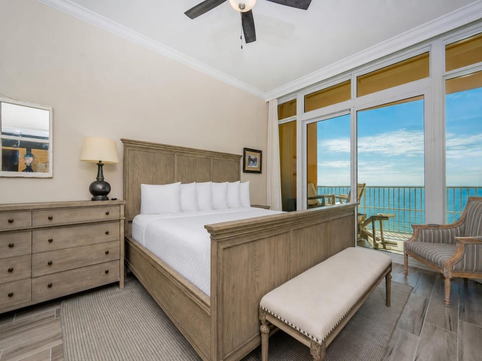 Retreat to the king master suite with cozy bedding and drift off to the sound of the waves from the balcony