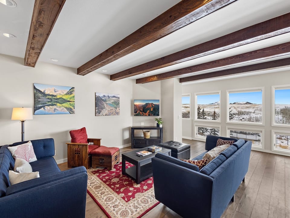 The family room is located a level a few steps below the kitchen