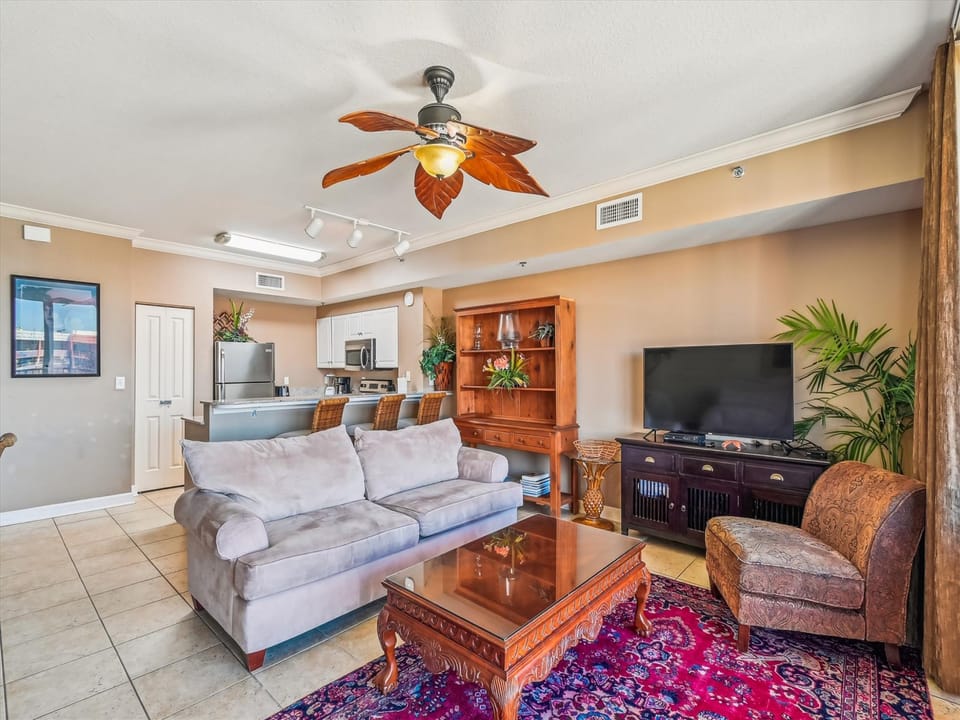 Living room with couch and love seat and chair/TV