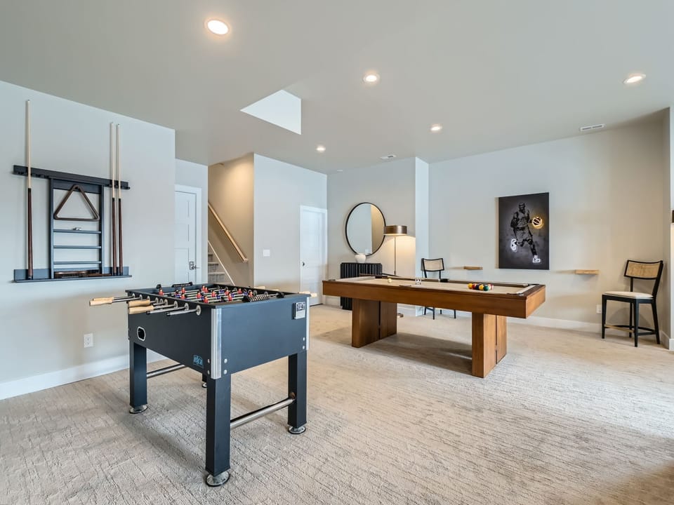 Downstairs Game Room with Pool Table and Foosball