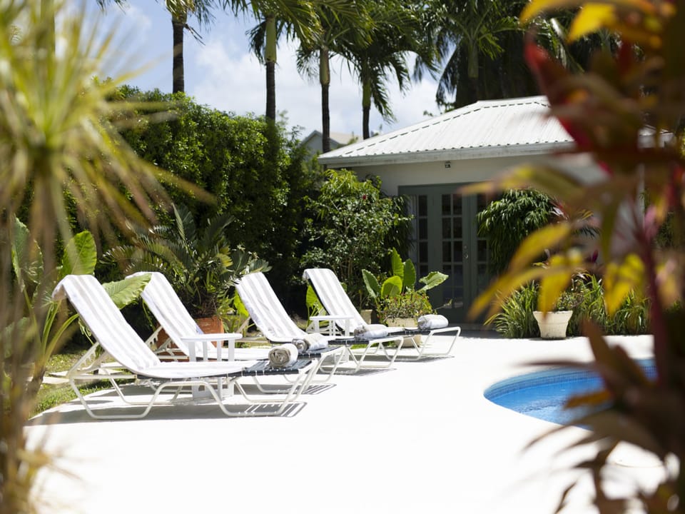 Relax by the pool on one of our sun loungers