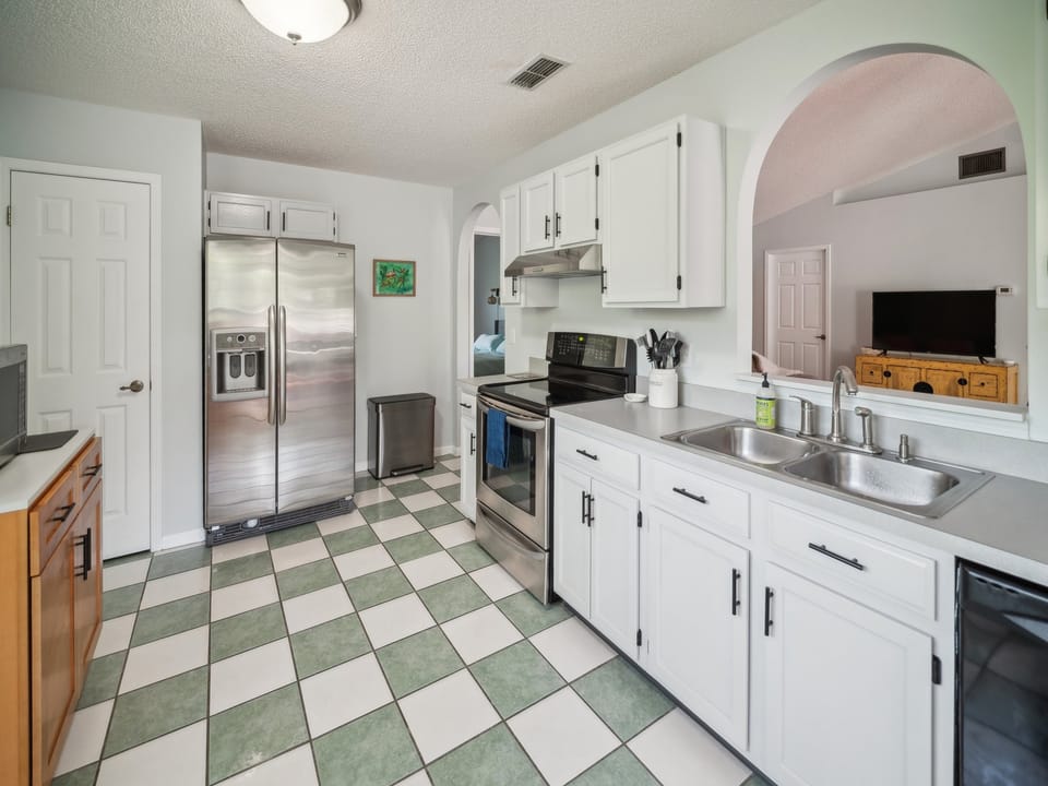Kitchen with view into great/living room & dining room