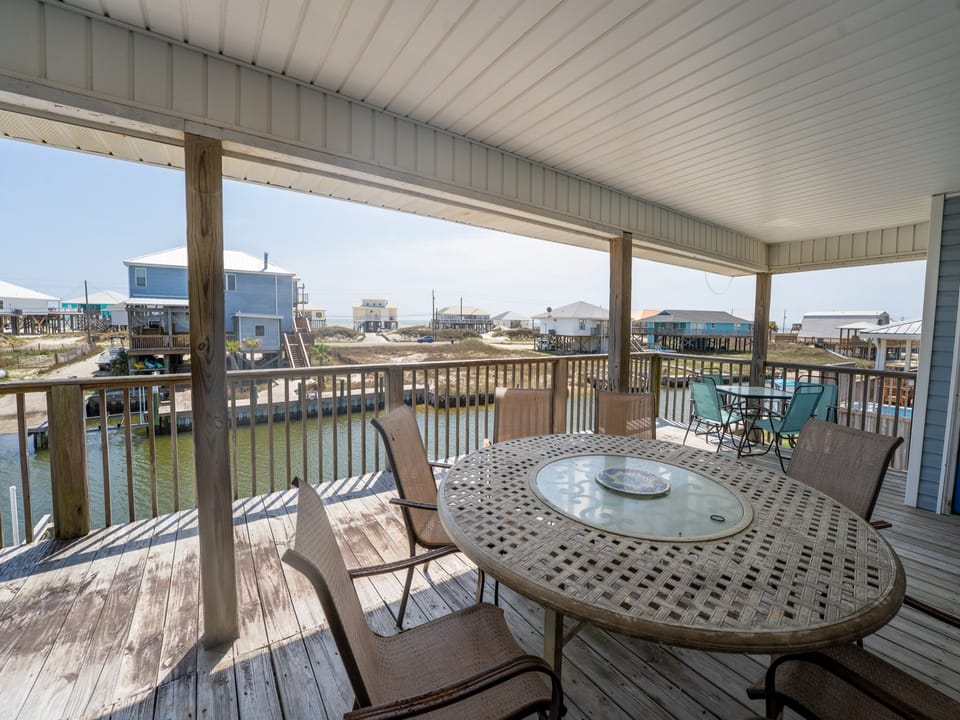 Anchor Eways Covered Balcony Outdoor Dining Space with Canal and Gulf View
