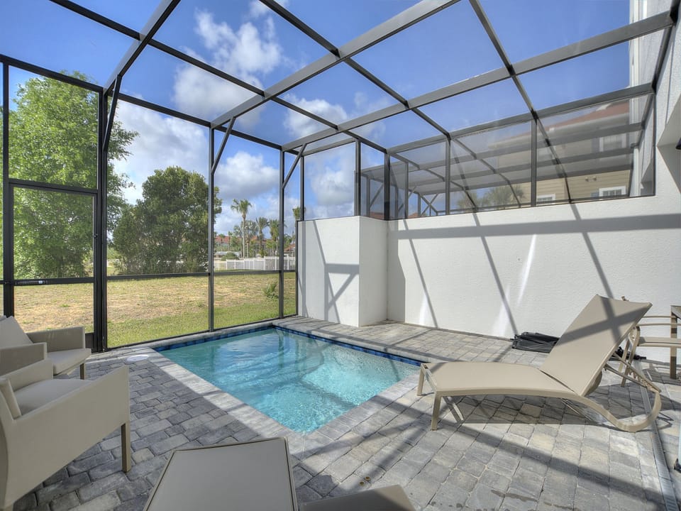 Relaxing Poolside Retreat with Enclosed Lanai