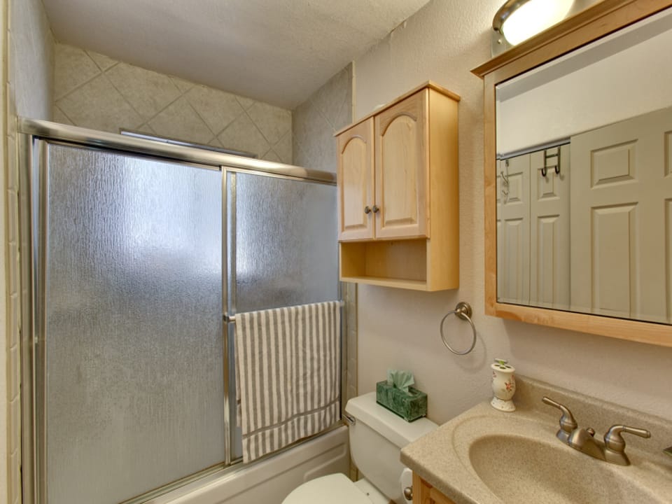 Second bathroom with a shower-tub combo, perfect for relaxing after a long day outdoors.