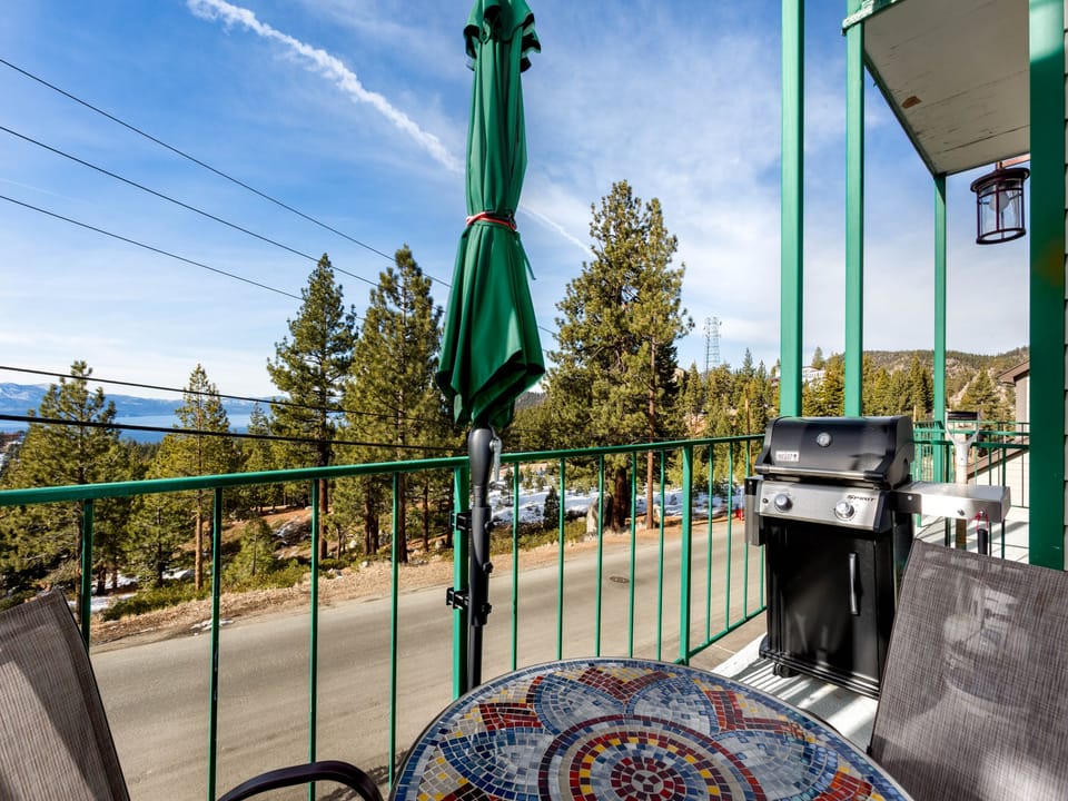 Private balcony with a grill, perfect for outdoor dining with a view.
