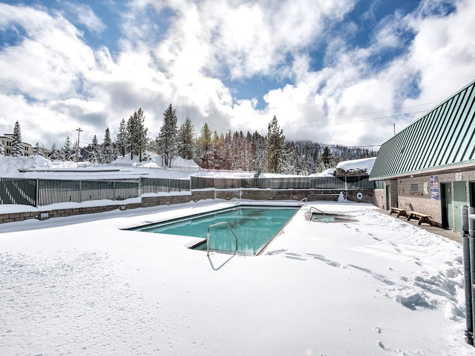 Experience the winter charm of the shared pool area, surrounded by snow.
