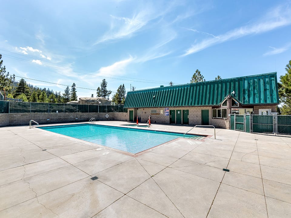 Take a refreshing dip in the shared outdoor pool, perfect for sunny days.