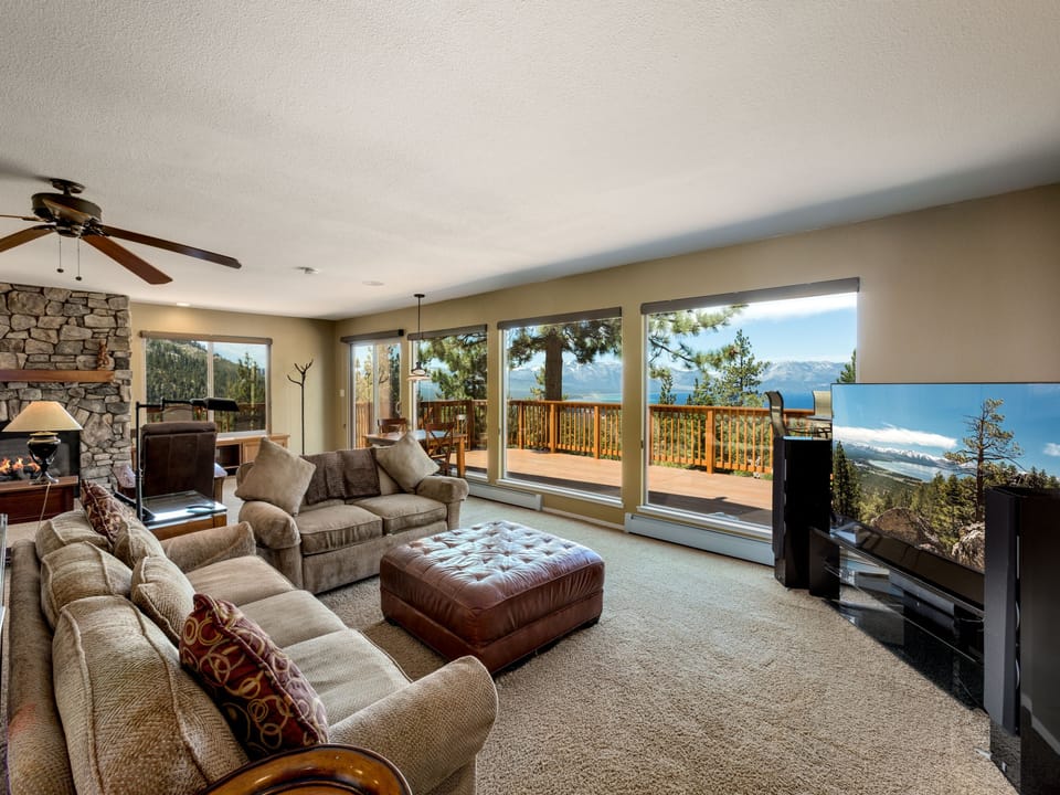 Relax in the spacious living room with floor-to-ceiling windows and stunning views