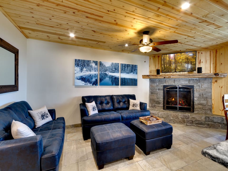 Modern and open living area with a fireplace, perfect for cozy evenings.