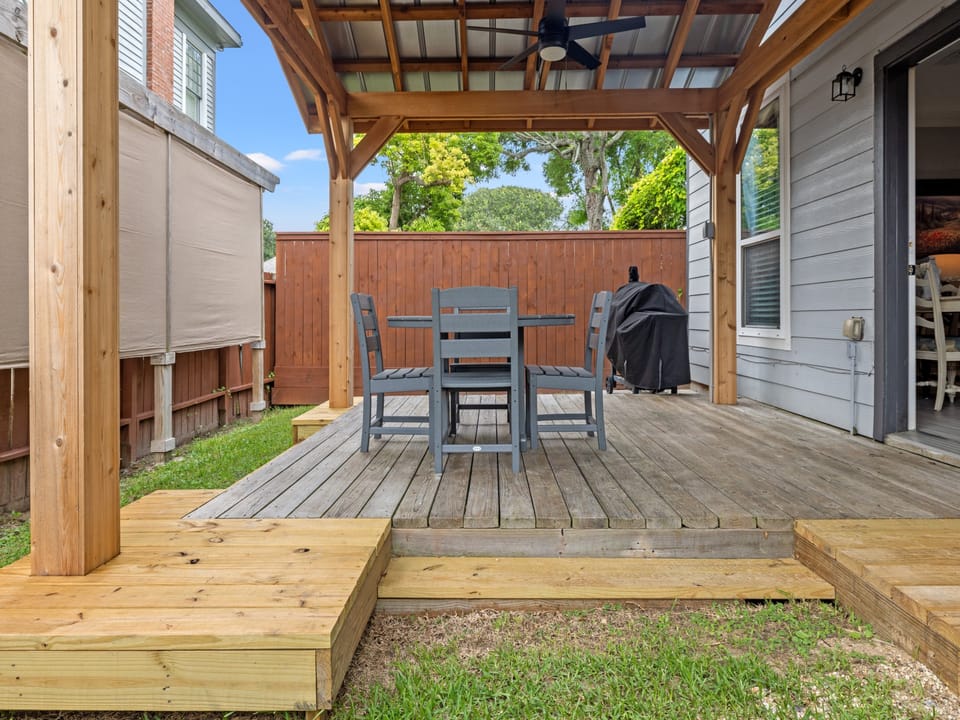 Private backyard with covered pergola and outdoor dining