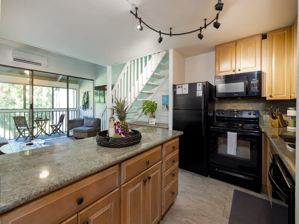 Open concept Living/Kitchen area with steps up to the LOFT space