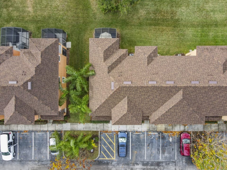 Overhead view of the property showcasing parking and private outdoor spaces.
