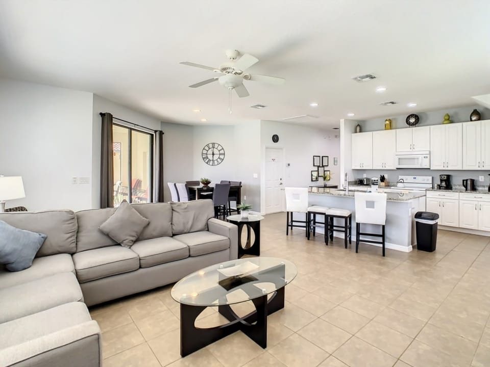 Comfortable living area with plush seating and a seamless connection to the dining space.