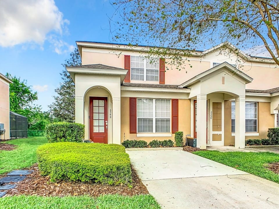 Charming exterior with a welcoming front entrance and manicured landscaping.