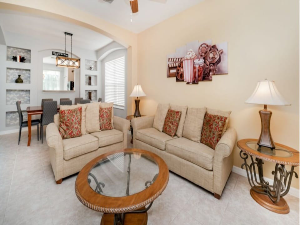Spacious living room with comfortable seating and warm, inviting decor.