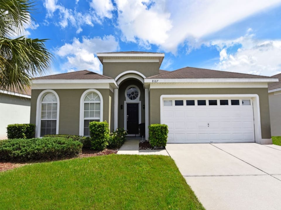 Welcoming front exterior with manicured lawn and stylish design.