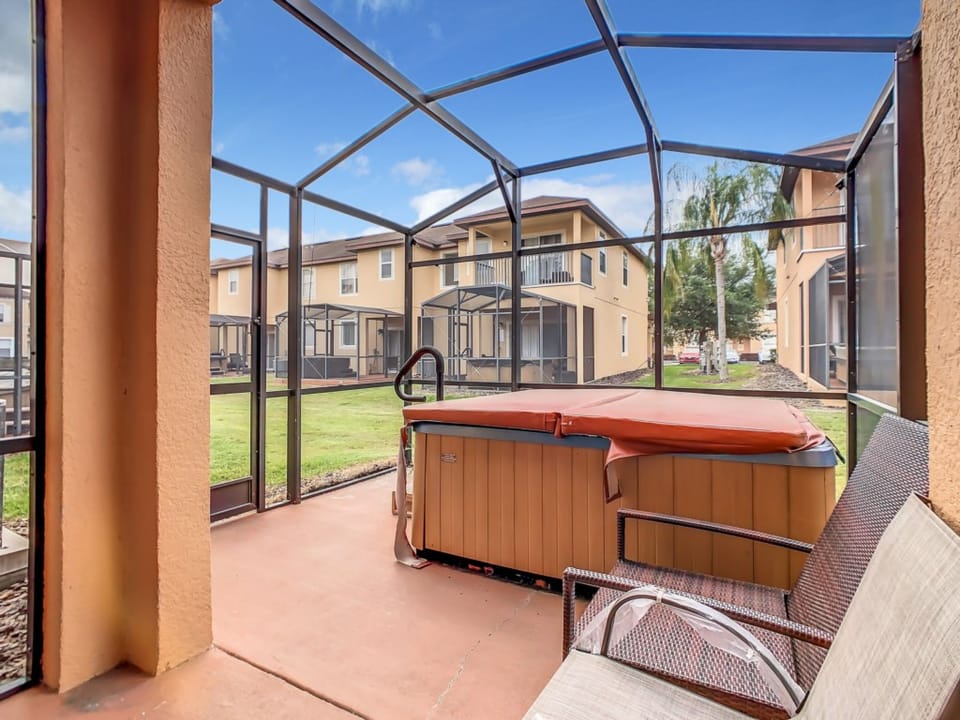 Enjoy the outdoors with a private patio featuring a soothing hot tub.