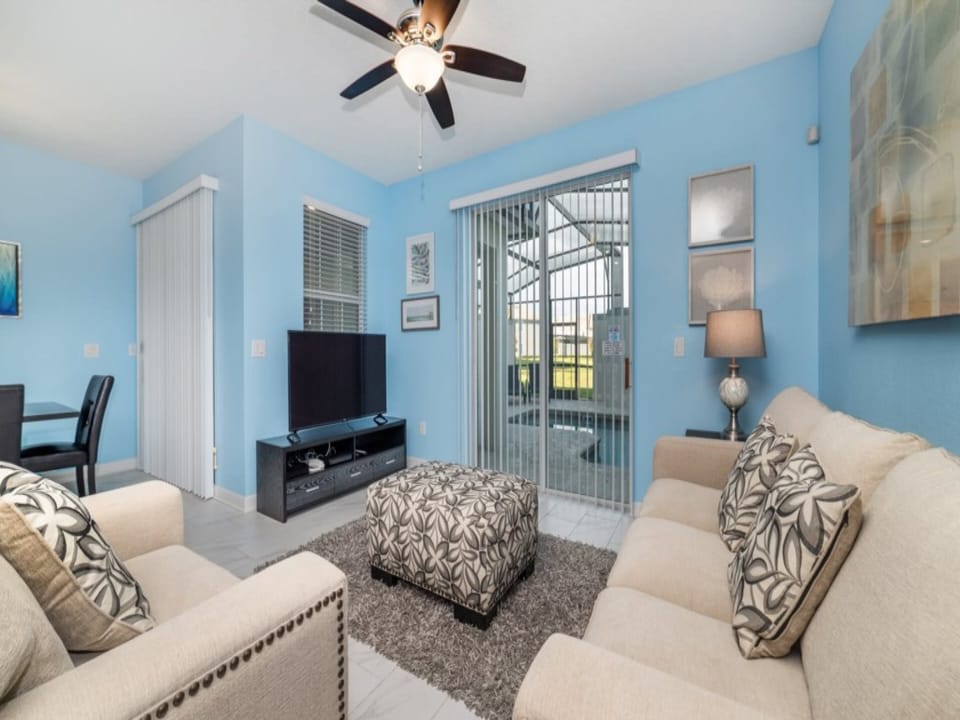 Bright and cozy living room with ample natural light and modern comforts.