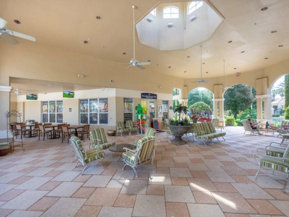 Bright and spacious clubhouse lounge with seating and a welcoming atmosphere.