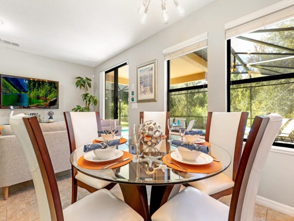 Dining area with seating for 5 and views of the patio/pool