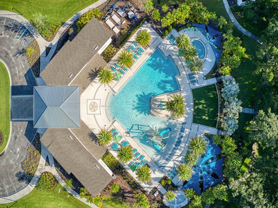 Aerial view of the stunning resort pool and beautifully landscaped grounds.