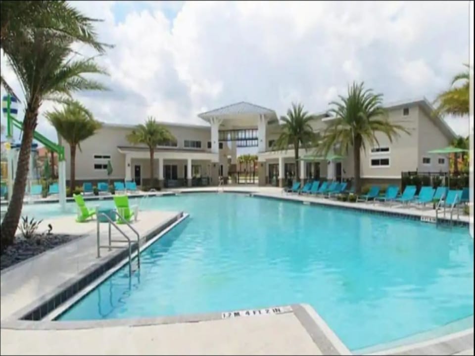 Expansive community pool with plenty of seating and space to unwind.