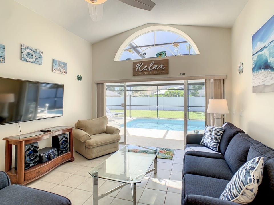 Cozy living room with large windows and inviting natural light.