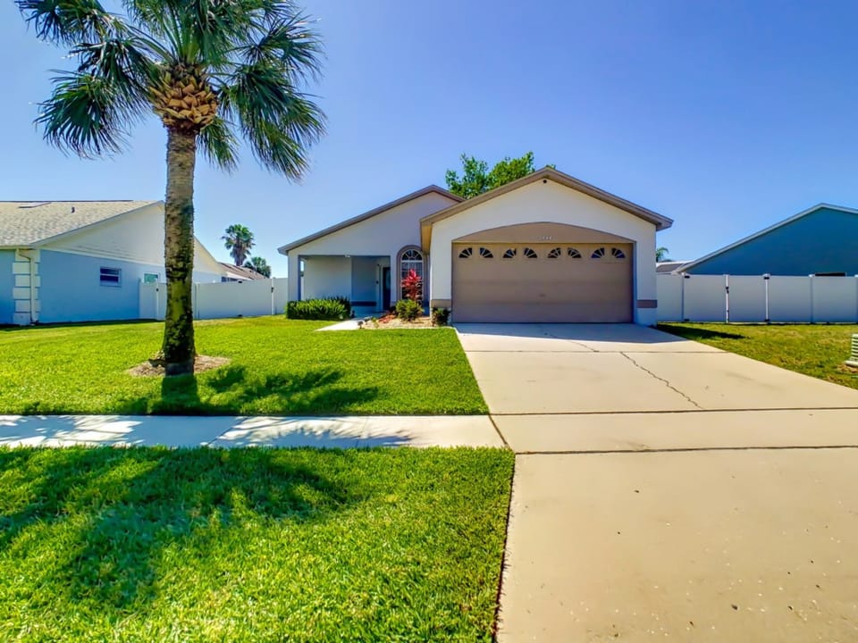 Front driveway leading to a charming and inviting home.