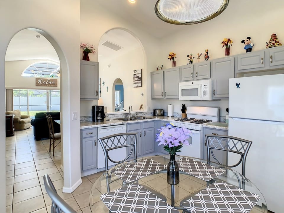 Bright kitchen with modern appliances and a charming dining area.