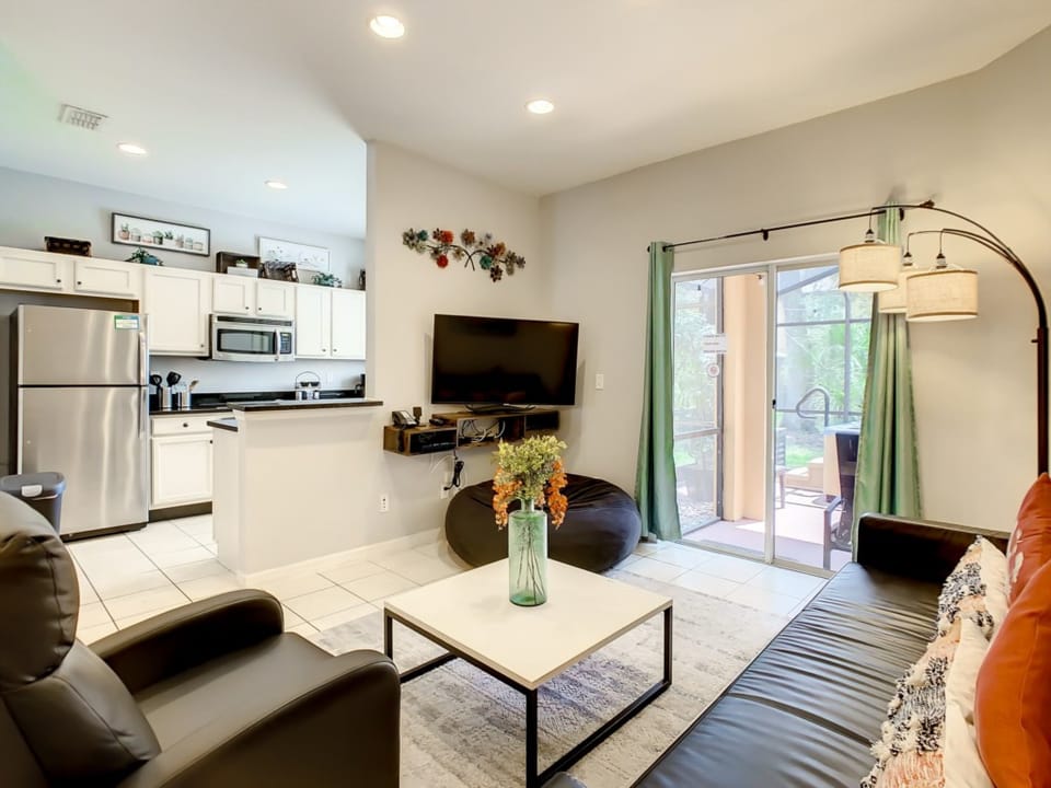 Open-concept living and dining area filled with natural light and modern touches.