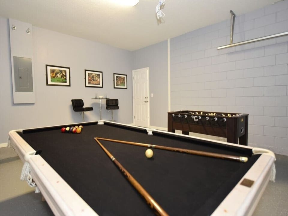 Challenge your friends to a game of pool in this stylish and fun recreation room!