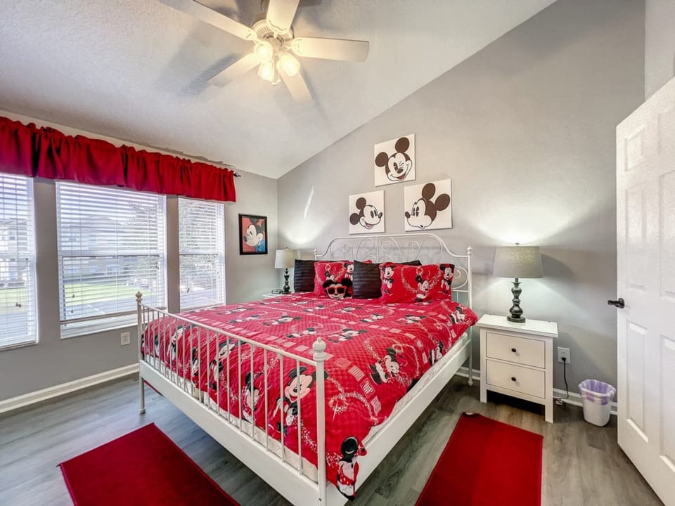 Charming Mickey Mouse bedroom with cozy bedding and playful decor.