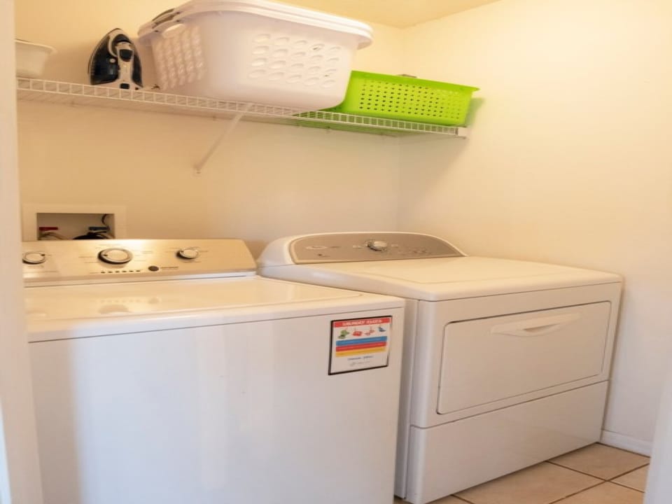 Convenient laundry room with washer and dryer for extended stays.