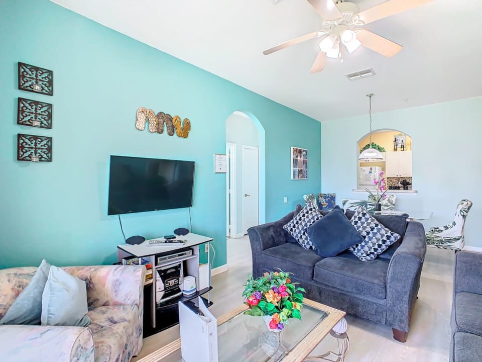 Cozy and inviting living room with modern amenities, designed for ultimate comfort and entertainment.