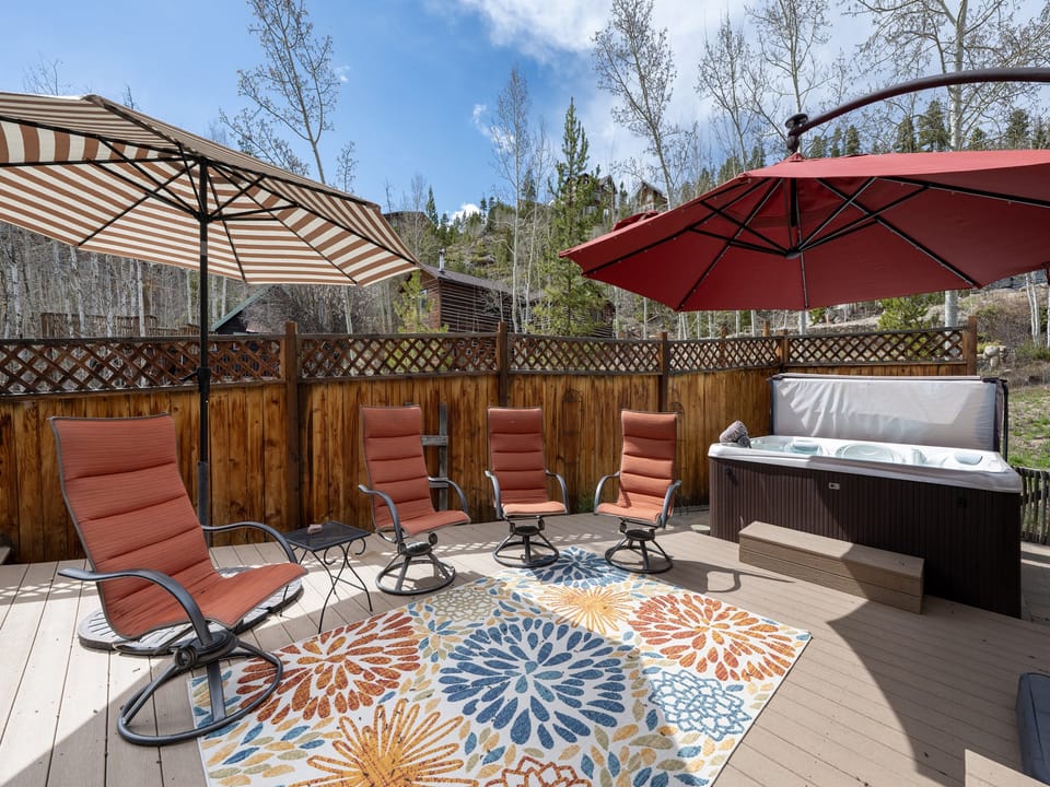 Spacious outdoor patio with private hot tub, gas grill, fire pit and plenty of seating!