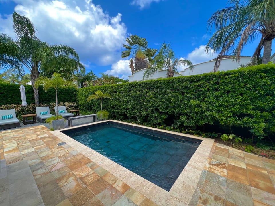 The private pool and lounge area invite you to relax with a book or soak up the sunshine