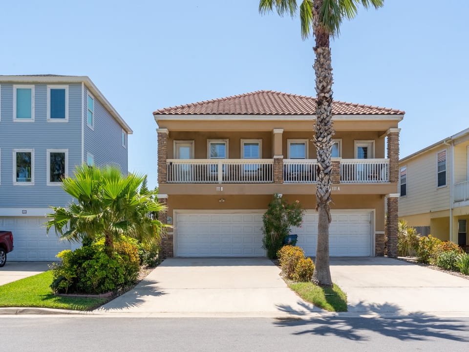 The townhome is located on the left side.
