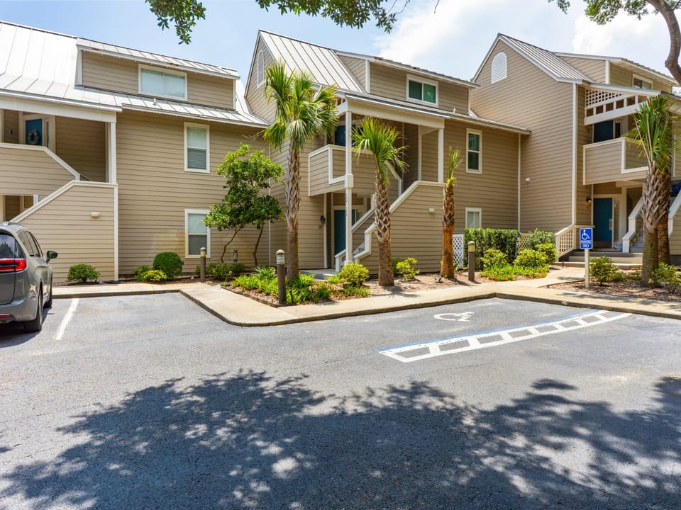 Coastal condo in Hidden Dunes Resort with beach access, tennis courts, pools, and lush surroundings.