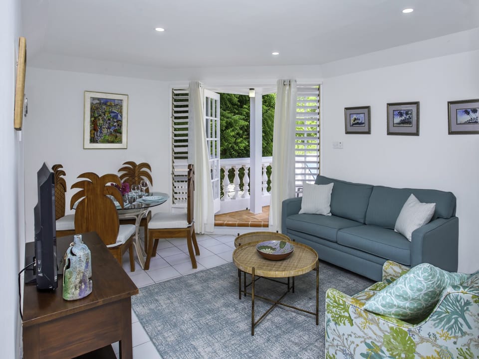 Comfy living room area with sleeper couch and airconditioning.