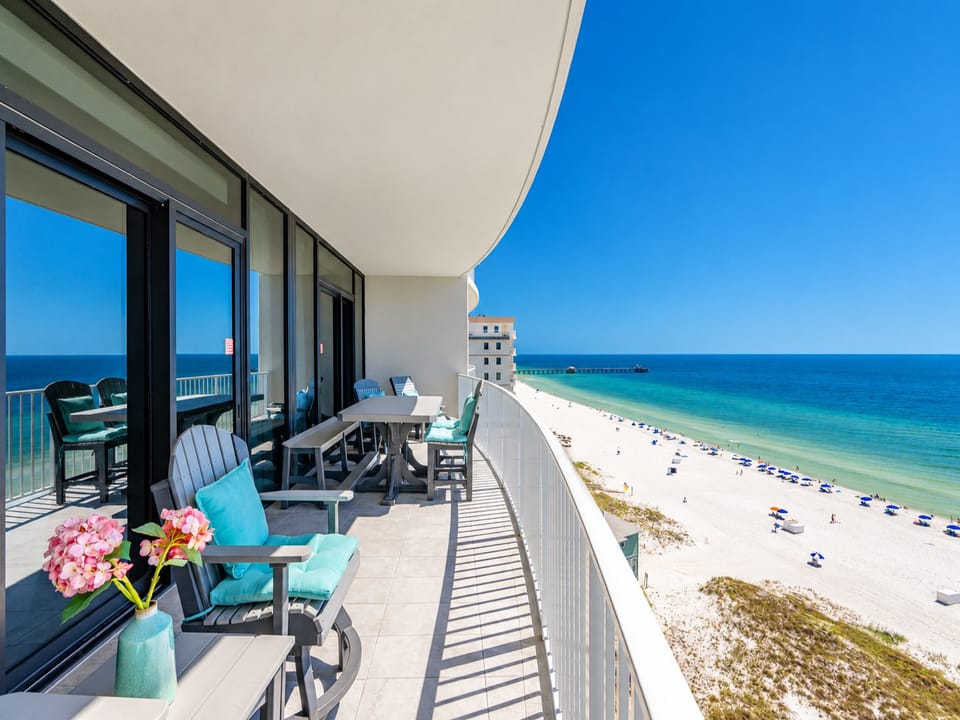 Enjoy meals or drinks on your spacious balcony, featuring comfortable seating and beautiful views of the shoreline