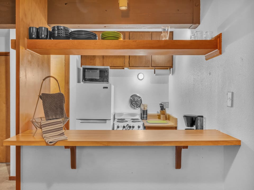 Pass through Breakfast Bar to Dining Area.  The Kitchen has all the essentials for cooking a great home cooked meal.